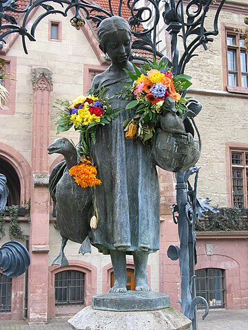 Gänseliesel fountain on the market square in Göttingen. Old townhall in the background. Image taken by Daniel Schwen on march 3rd 2006.